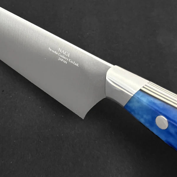 Ergonomic blue bone handle on Japanese chef knife