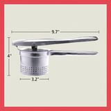 Handheld stainless steel potato press used for preparing cooked potatoes in a home kitchen.