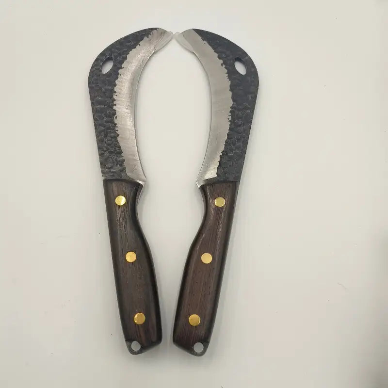 Survival sickle used for bushcraft and wilderness tasks